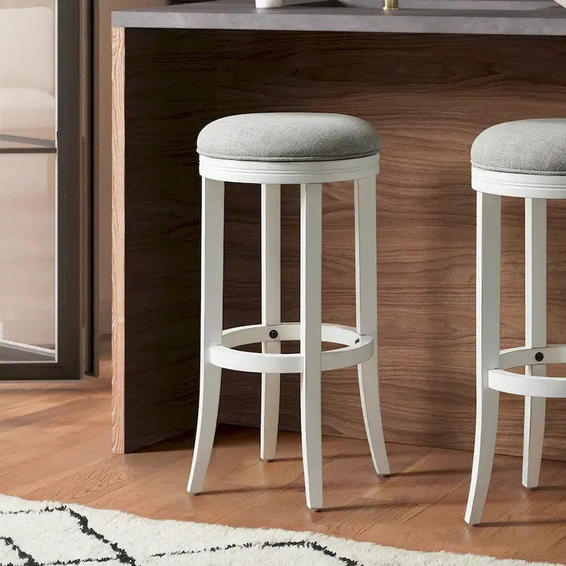 Tabouret de bar pivotant sans dossier en bois blanc avec assise en tissu gris